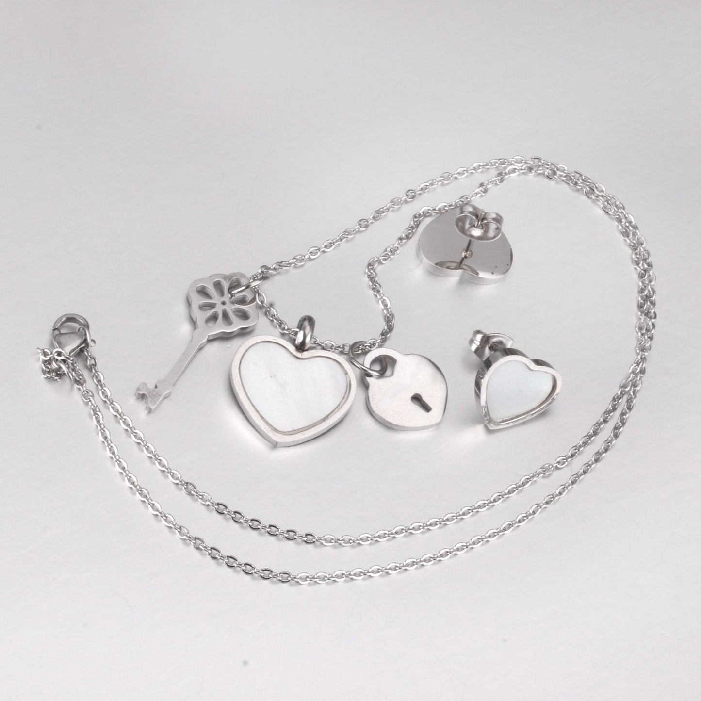 Steel/Gold Cut Three Shapes Pendant with White/Black Shell Jewelry Set